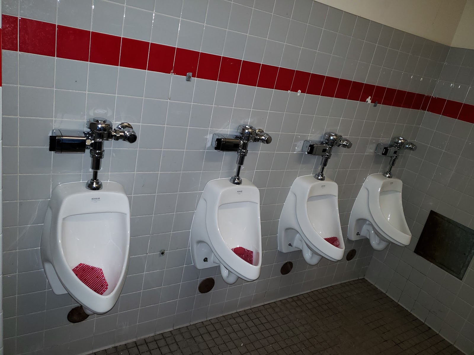 Commercial urinals with flush valves installed